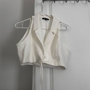 White top that has a lace for stomach area